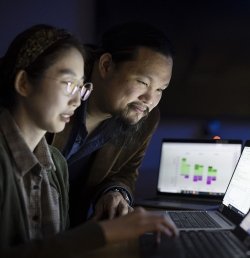 Two data scientists at the Marcus Institute for Aging Research in Boston, MA look at a laptop.