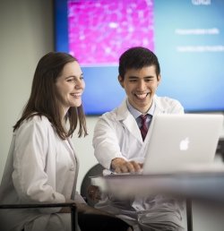 Two medical fellows in geriatrics sit working together at the Marcus Institute for Aging Research in Boston, MA