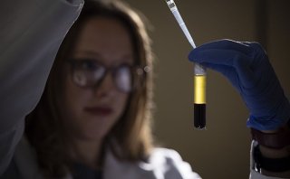 A researcher at the Marcus Institute for Aging Research in Boston, MA holds a vial of blood.